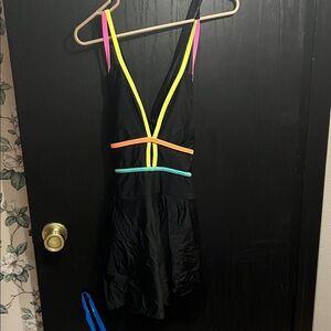 Vibrant Trim Black Women's One Piece Swimsuit with skirt overlay